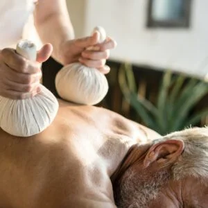 Massage therapist massaging at a spa