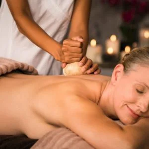 Mature woman having ayurvedic massage